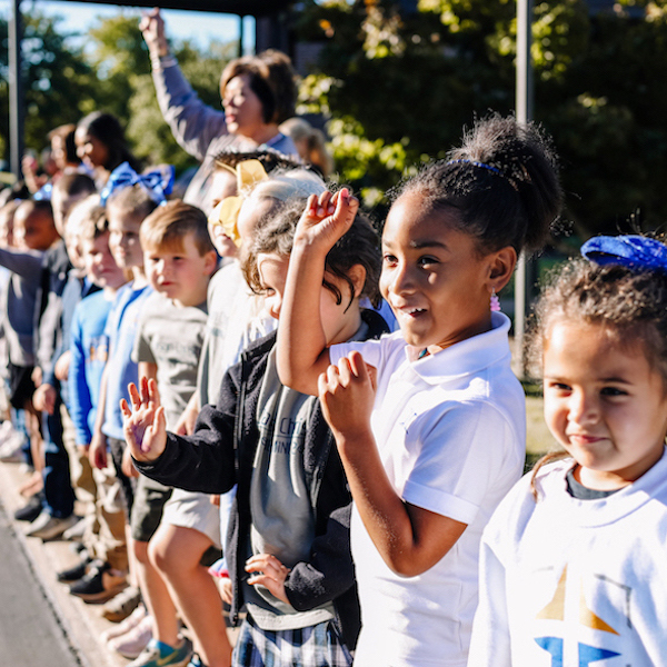 Jackson Christian Elementary students wave during the homecoming parade.